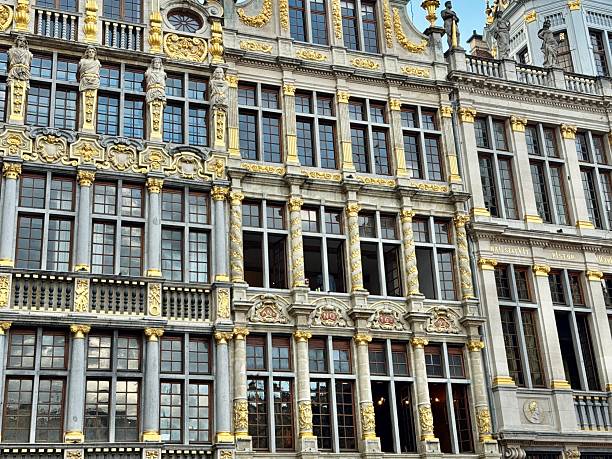 Brussels, Belgium: July 16, 2025 -The Grand-Place is the central square of Brussels, Belgium. It is surrounded by by opulent Baroque guildhalls, Town Hall, and the King’s House or Bread House.