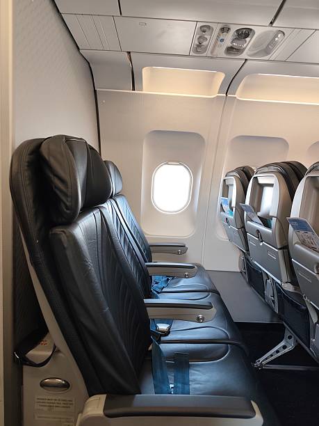 istock Black leather economy seats on the plane 2229741759