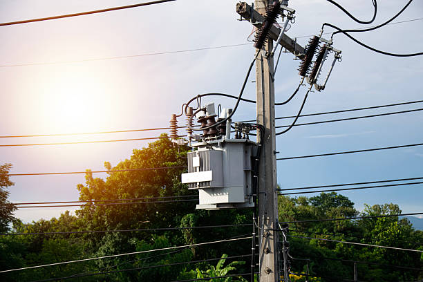istock Large electric transformers installed on electric poles 2229742656