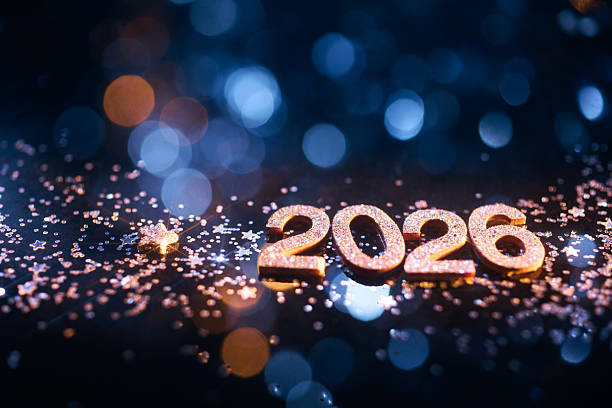 istock Glittering 2026 New Year Celebration with Stars and Soft Blue Bokeh Lights 2229743890