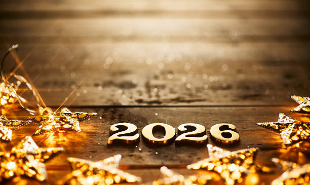 istock Golden 2026 Surrounded by Sparkling Star Lights on Warm Rustic Wooden Surface 2229743920