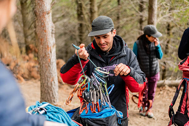 istock Young man adjusting safety equipment for outdoor climbing 2229746714