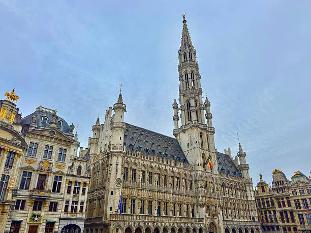 Brussels, Belgium: July 16, 2025 -The Grand-Place is the central square of Brussels, Belgium. It is surrounded by by opulent Baroque guildhalls, Town Hall, and the King’s House or Bread House.