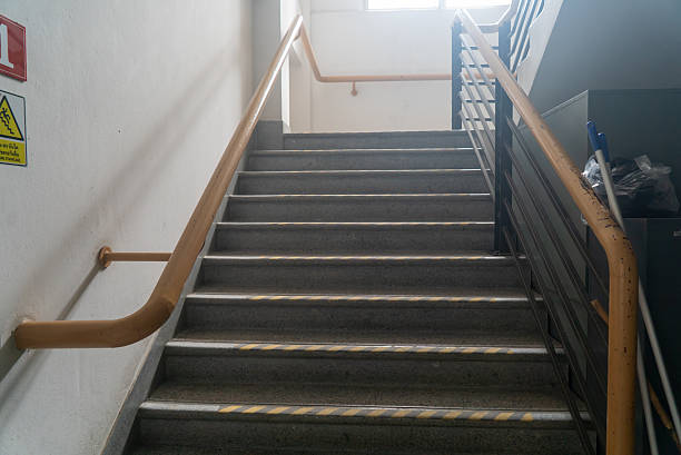 istock Modern Staircase with Handrail and Safety Markings 2229748118
