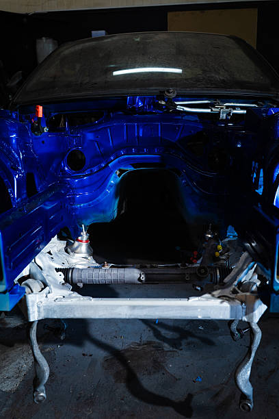 istock Project drift car in a raw phase before installing suspension, massive tires, and clean detailing work. Drift Car Chassis Build - Custom Painted and Stripped Drift Project in Progress. 2229749527