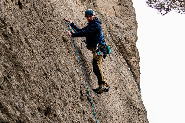 istock Climber climbing mountain in Patagonia, Argentina 2229750401