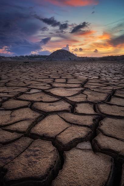 istock Cracked Dry Earth During Sunset with Dramatic Sky 2229751729