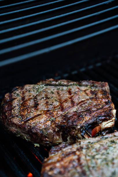 istock Well grilled huge steak on BBQ gas grill 2229751762