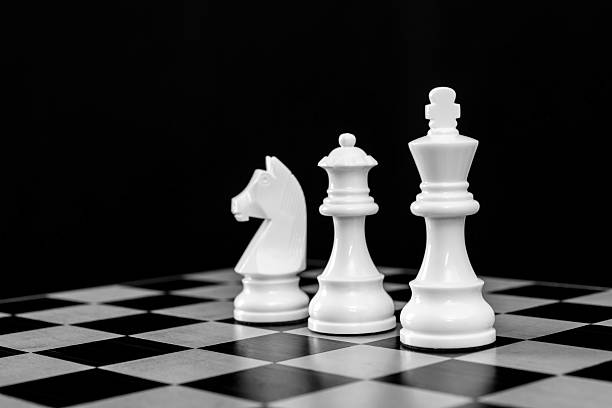 istock Chess king, queen and knight on chess board 2229751795