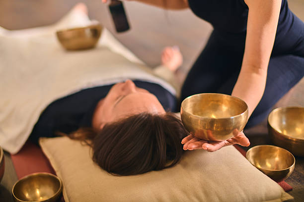 istock Sound healing with singing bowls in tranquil setting 2229757081