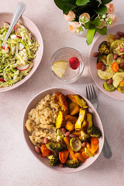 istock A nutritious breakfast spread includes quinoa, baked sweet potatoes, carrots, zucchini, broccoli, beans, tender chicken breast, and a vibrant fresh salad, ready for enjoyment 2229757900