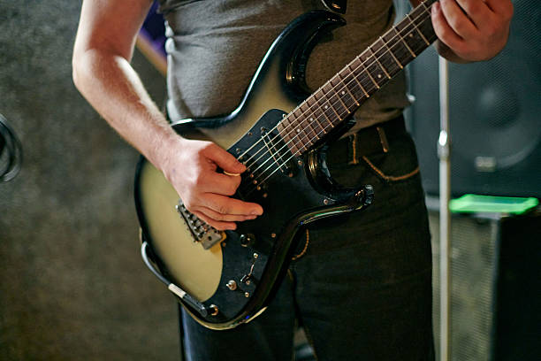 istock Close up of Electric Guitar Playing Hands 2229764269