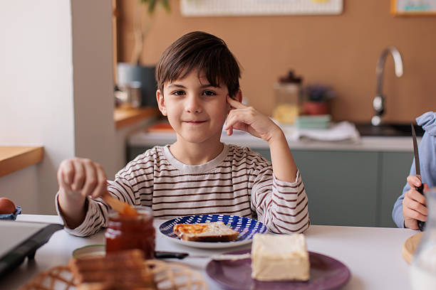 istock Young Boy Making Sweet Sandwich for Breakfast 2229764434