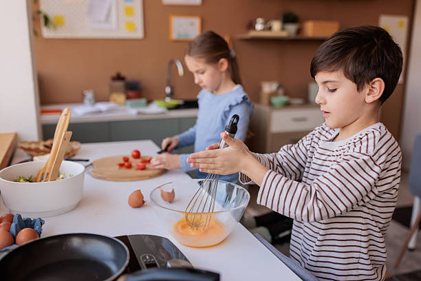 istock Siblings Making Breakfast Together at Home 2229764644