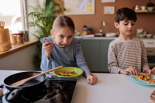istock Children Enjoying Self-Prepared Breakfast Meal 2229764900