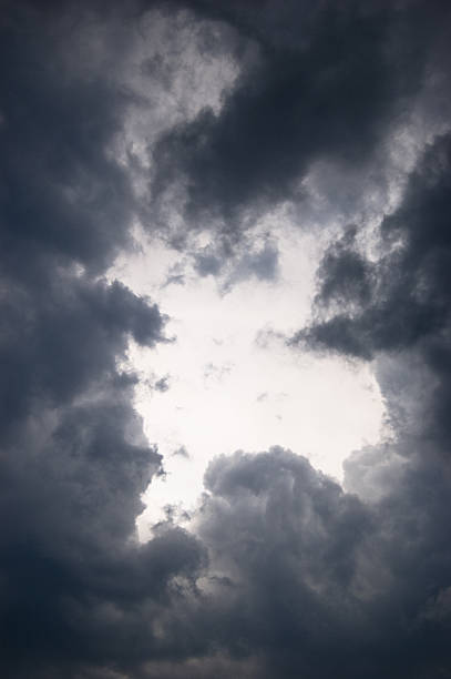 istock Storm clouds closing around clear sky before summer storm 2229766455