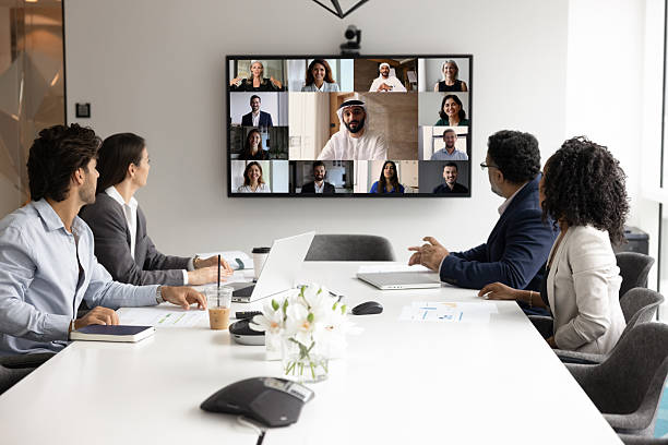 istock Multiethnic businesspeople gather at boardroom for virtual conference with colleagues 2229771509