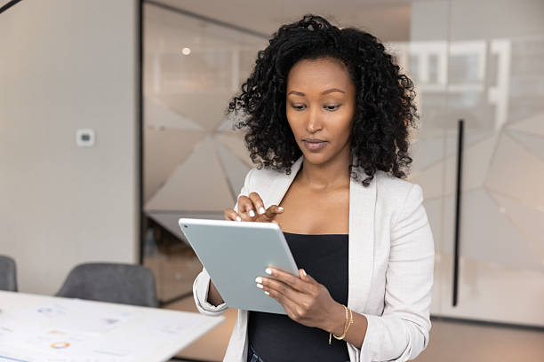 istock Focused millennial businesswoman work on digital pad in office 2229773237