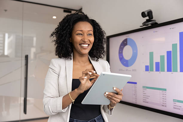 istock Successful smiling young businesswoman use digital tools to develop strategies 2229774467