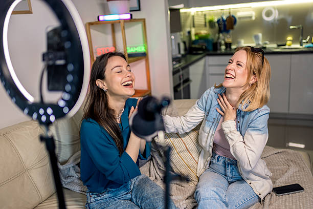 istock Happy Female Podcasters Laughing During Home Recording 2229779986