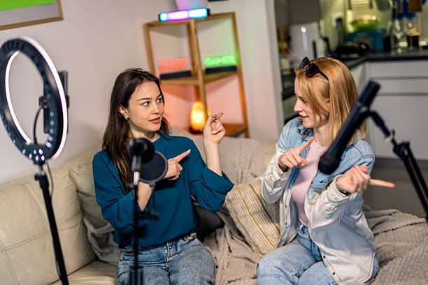 istock Female Podcasters Dancing During Home Recording 2229779988