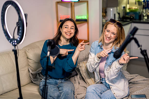 istock Female Podcasters Dancing During Home Recording 2229779996