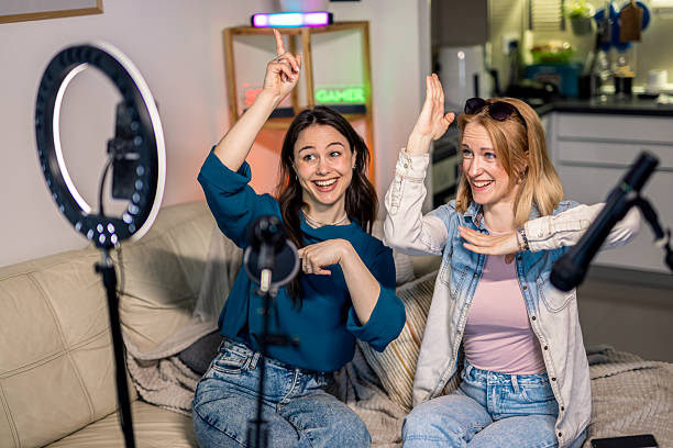 istock Female Podcasters Dancing During Home Recording 2229780172