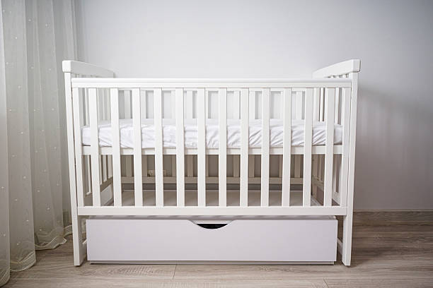 istock Modern white baby crib in minimalist nursery. 2229785025