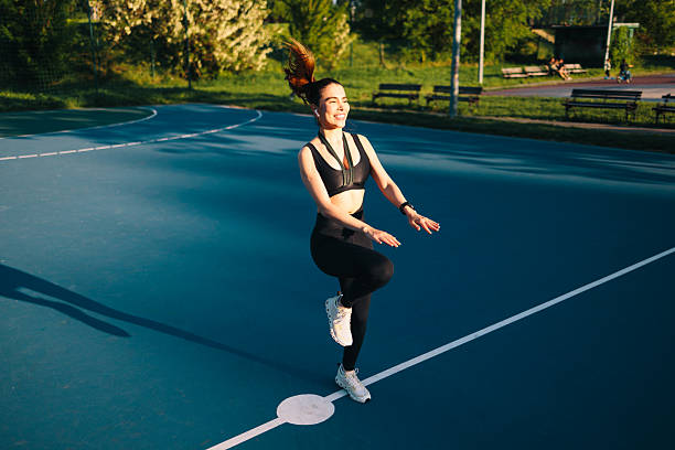 istock Young sportswoman doing high knee skips during outdoor workout 2229785219