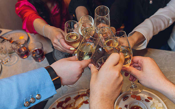 istock Clinking glasses with alcohol and toasting, party. 2229789422