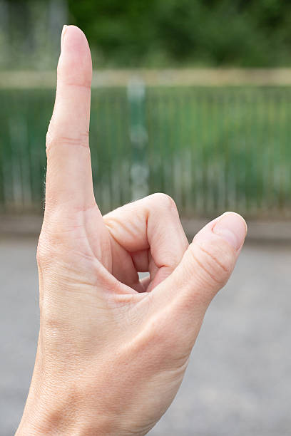 istock A closeup view of a hand skillfully making a detailed finger sign 2229792413