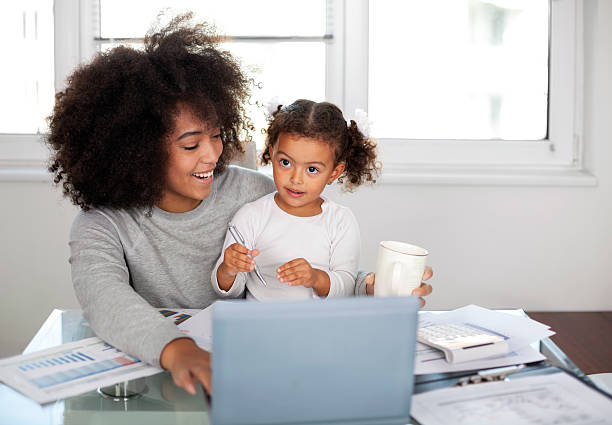 istock Young mother working and spending time with her daughter 2229793808