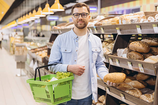 istock Customer choosing bread in supermarket bakery section 2229793894
