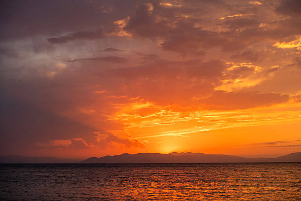 Beautiful sunset over the lake and mountains.