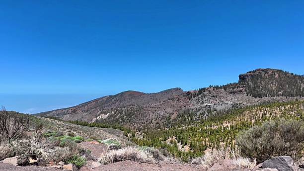 istock A stunningly beautiful mountainous landscape is set against a clear blue sky overhead 2229797982