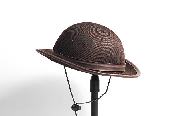 istock Scout hat hanging on a mini tripod isolated on a white background 2229804405
