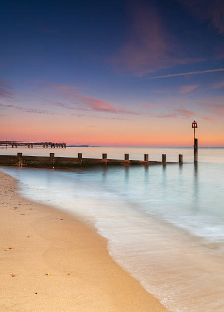 istock Bournemouth beach illuminated by the setting sun at sunset 2229818382