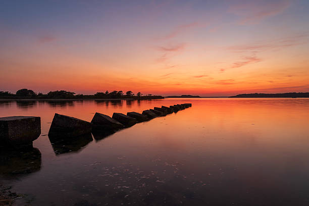 istock Dargon's Teeth at Sunset in Poole Harbour with calm waters 2229818571