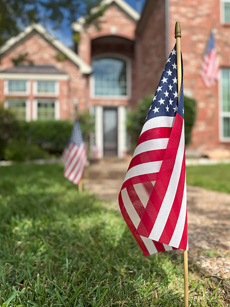 istock American flags displayed in front of a southern home 2229821915