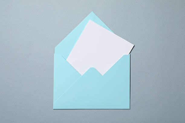 istock Letter envelope with card on grey background, top view 2229823834