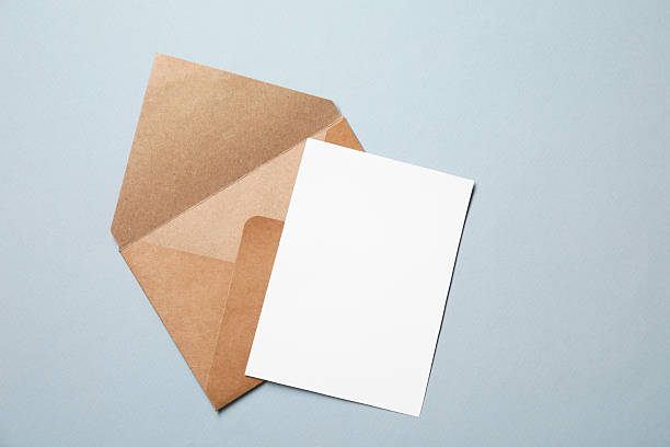 istock Letter envelope and card on grey background, top view. Space for text 2229823914
