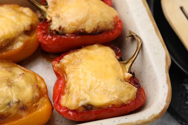 istock Delicious stuffed bell peppers in baking dish on table, closeup 2229826681