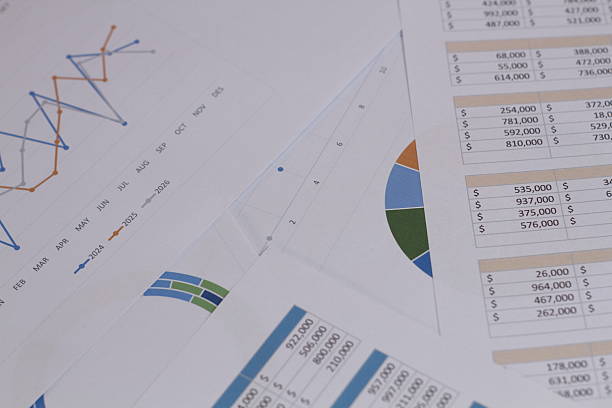 Businessman analyzing data charts and reports for marketing strategy, financial planning, accounting, and business development in modern office