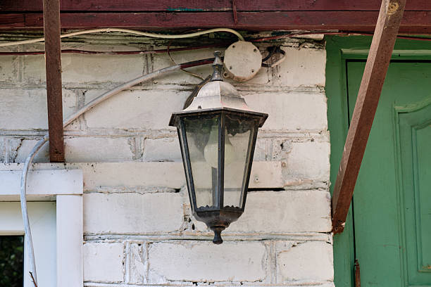 istock Vintage lantern illuminates rustic home entrance in a serene countryside setting 2229831434