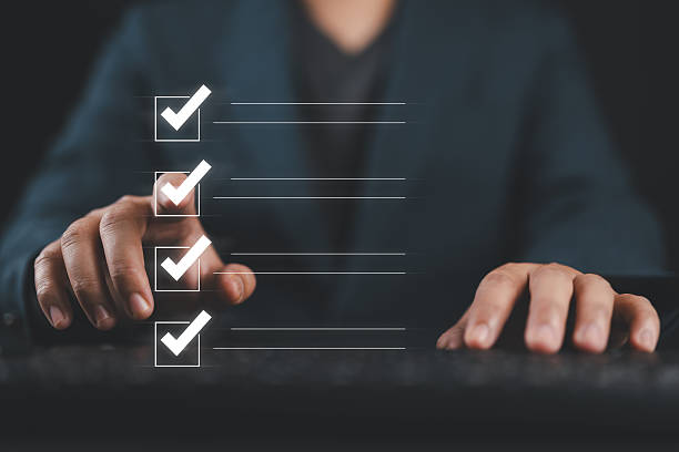 istock Quality control and check list, Businessman touch to tick correct sign mark in checkbox for quality document control checklist and business approve project concept. 2229833447