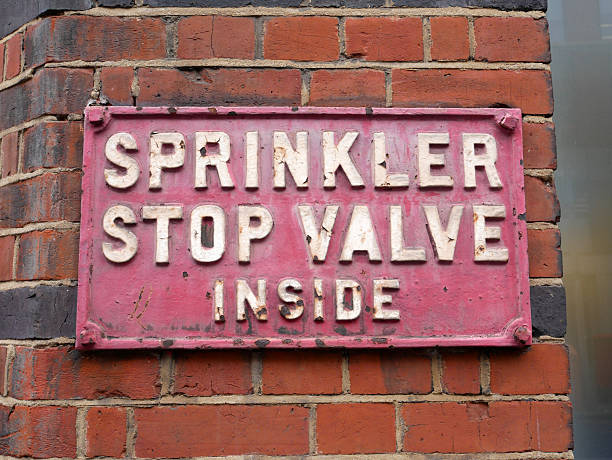 istock A red Sprinkler Stop Valve Inside metal sign on a red brick wall 2229841509