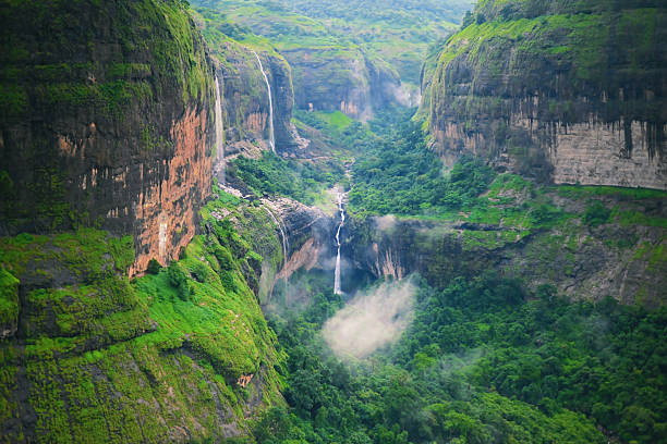 istock Majestic Valley with Cascading Waterfalls in Monsoon Mist 2229846736