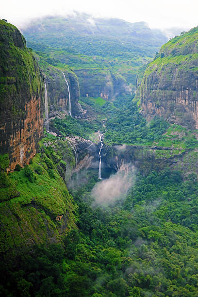istock Majestic Valley with Cascading Waterfalls in Monsoon Mist 2229846756