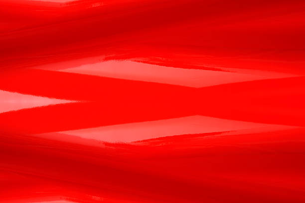 Overhead shot of red shiny vinyl wave abstract background.