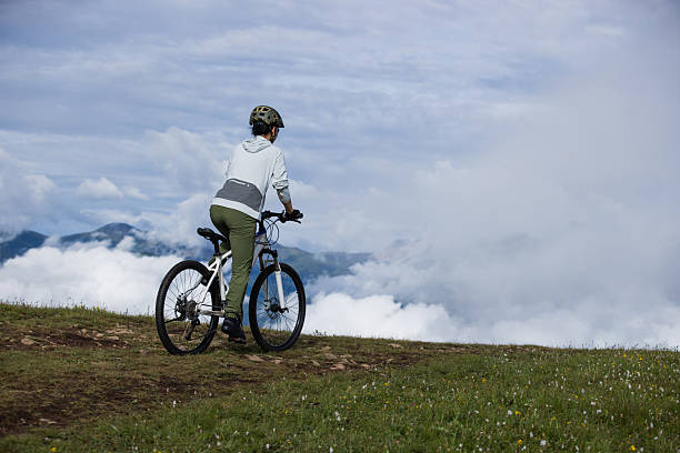 Riding mountain bike on beautiful mountain top